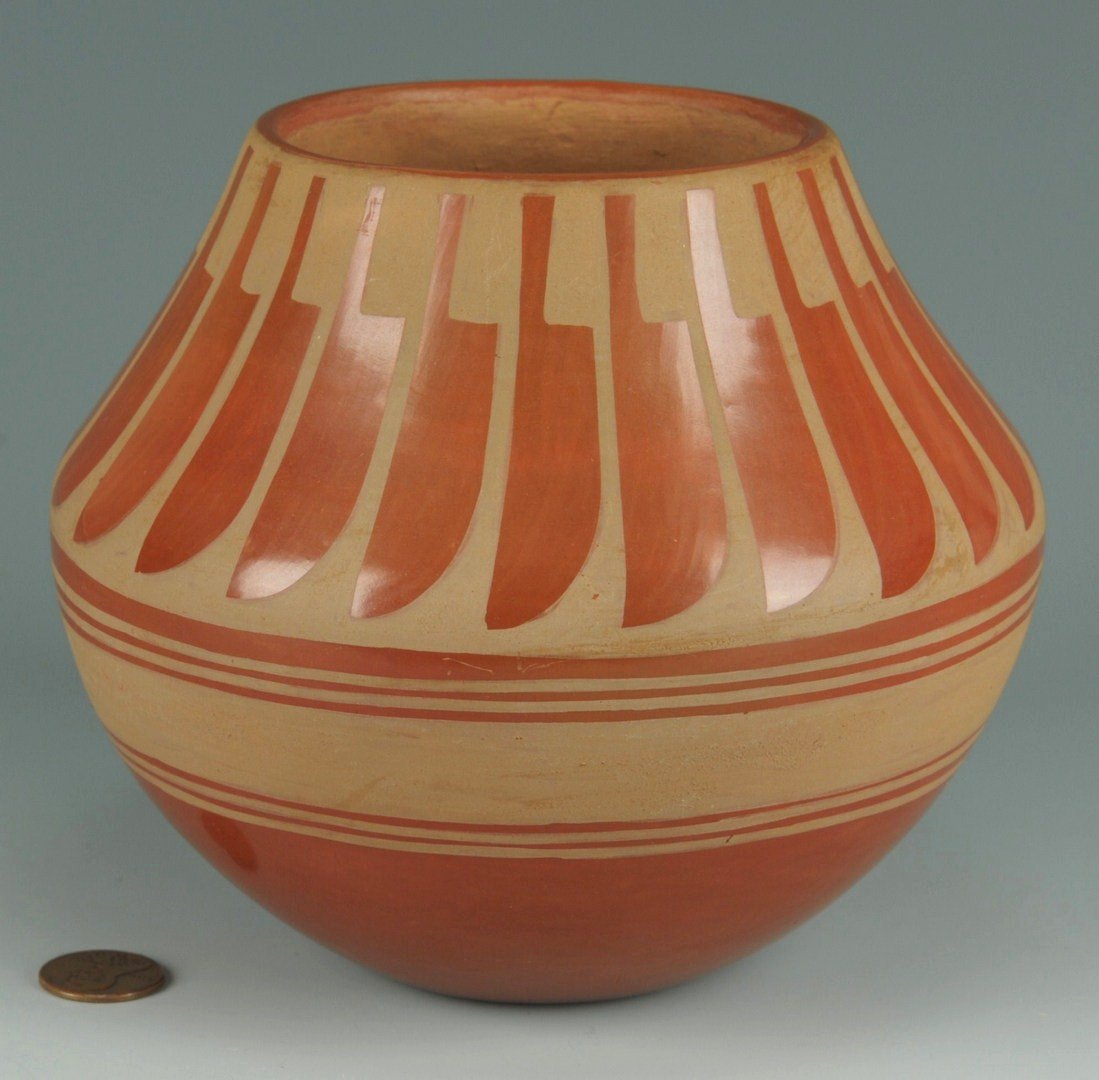 San Ildefonso redware jar, Blue Corn: San Ildefonso redware pottery olla or jar, band of feather decoration at neck, signed on base Blue Corn/San Ildefonso Pueblo (Crucita Calabaza, 1920-1999). 5"H x 6" Diam. Provenance: A Middle Tennesse