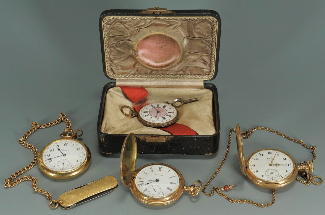 Four pocket watches and a knife: Four late 19th to early 20th century pocketwatches and a knife. 1st item: Waltham watch in gold filled embossed and engraved hunting case, monogrammed CK, the enameled porcelain dial with seconds hand