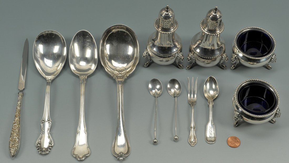 Silver salt items and assorted flatware, 12 pcs: Lot of assorted silver including a pair of baluster form, footed salt and pepper shakers with lion masks and paw feet, marked Sterling, 5"H; a pair of open salt cellars with lion mask and paw feet and