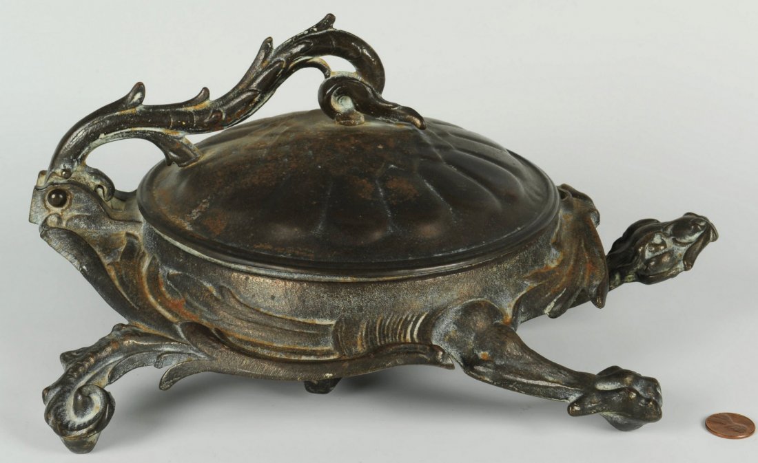 Bradley and Hubbard Dragon Spittoon: Bradley and Hubbard cast iron dragon form figural spittoon or cuspidor, with push-lever activated lid. Stamped 3612. 5" H x 9" W x 11-1/2" D. Early 20th Century.
