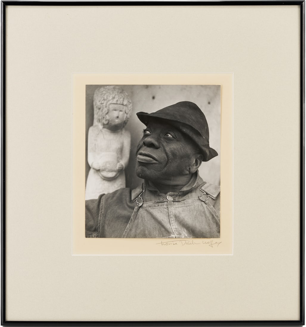 Louise Dahl-Wolfe Signed Photograph, Portrait of William Edmondson: Louise Dahl-Wolfe (American, 1895-1989) signed silver gelatin photograph depicting Nashville African American sculptor William Edmondson (Tennessee, 1874-1951) shown bust-length and looking up and to