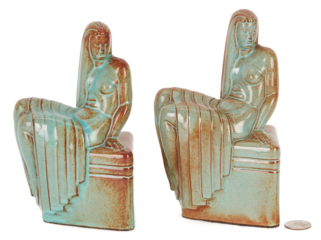 Pair of Art Deco Bookends, Chester Nicodemus: Chester Nicodemus (American/Ohio, 1901-1990) rare pair of ceramic Art Deco bookends depicting nude female figures seated on plinths. 7 1/2"H. Circa 1930. Note: Chester Nicodemus founded and produced h