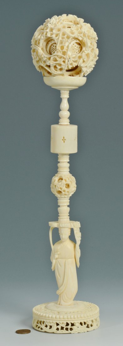 Large Carved Asian Ivory Puzzle Ball on Stand: Large carved Asian ivory puzzle ball. Intricately carved dragon design on the outer ball with nine other carved balls visible inside. Figural stand also has a puzzle ball carved into the shaft. Stampe