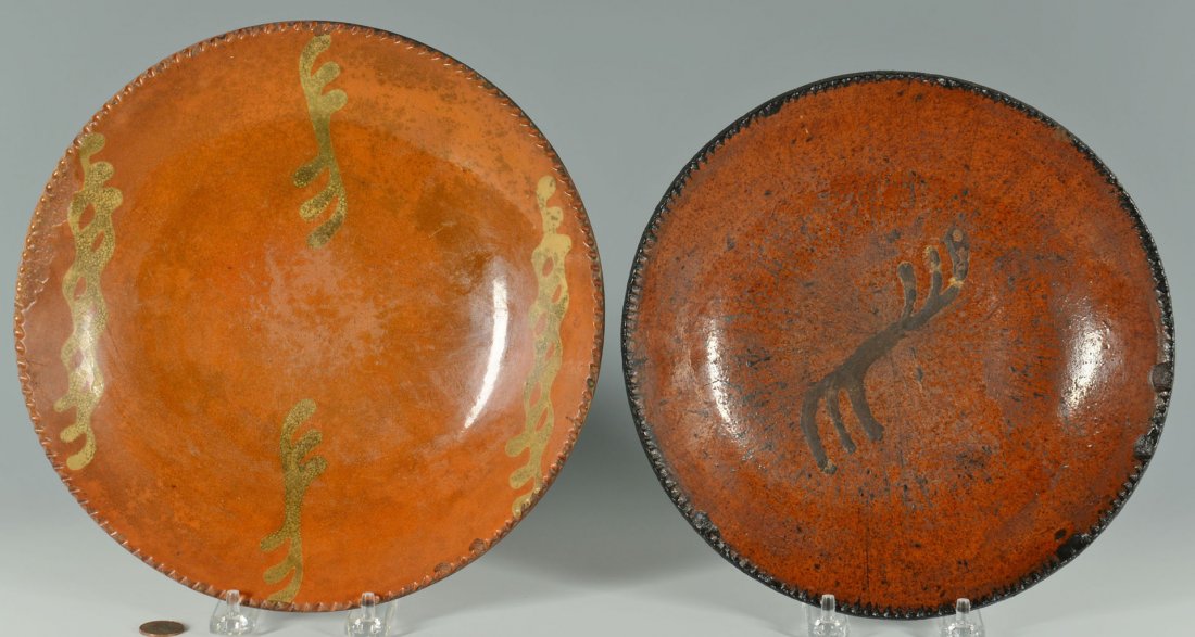 Pair of 19th c. slip decorated redware plates: Pair of 19th century slip decorated redware plates. 1st item - Slip decorated redware plate or charger, crow feet designs in middle with sine wave designs at top and bottom. Crimped edge. Overall exce