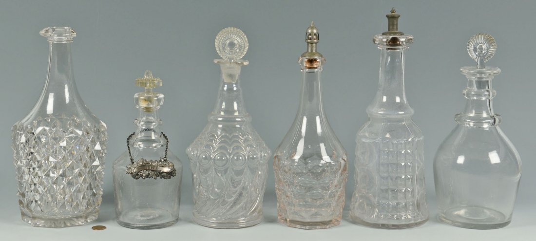 6 Glass Decanters, 19th century: Grouping of 19th century glass decanters, total 6. Includes a blown molded decanter single neck ring and flanged mouth, plain base with rough pontil mark, period stopper, horn of plenty design, attrib
