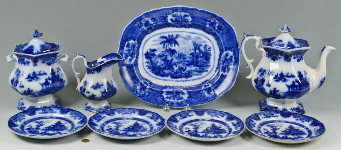 Group of Flow Blue, Lahore and Oriental: Group of Flow Blue, the Phillips and Son pattern "Lahore" and Burslem and Ridgway "Oriental". 1 large platter, 4 plates, lg coffee pot w/ lid, lg pot w/ handles and lid, medium pit