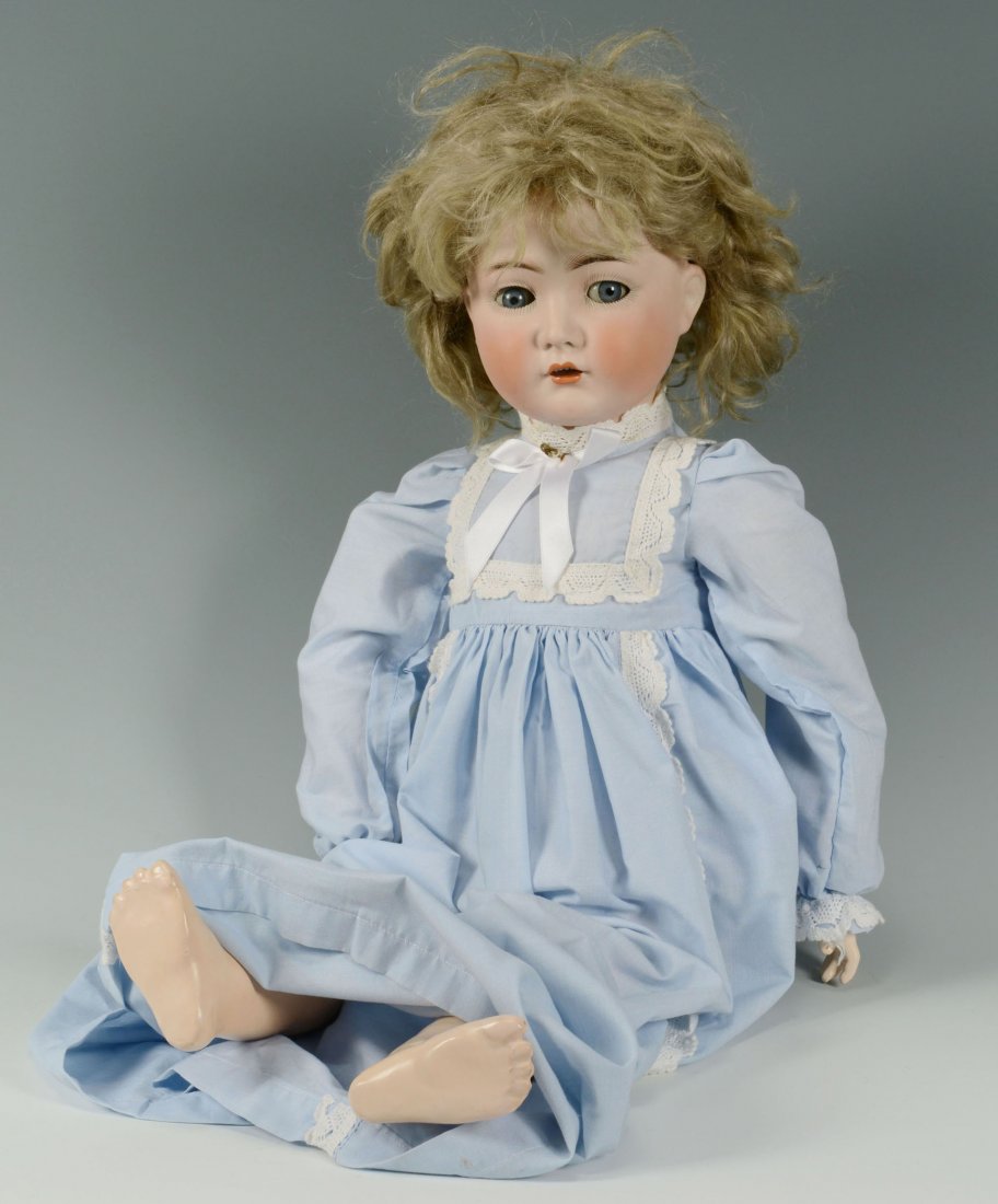 Simon & Halbig For Kammer & Reinhart German Doll: Simon & Halbig For Kammer & Reinhart German bisque head doll, No. 117 N, with blue sleep eyes, blonde mohair wig, open mouth, hand painted features and a composition and wood ball jointed body. Marked