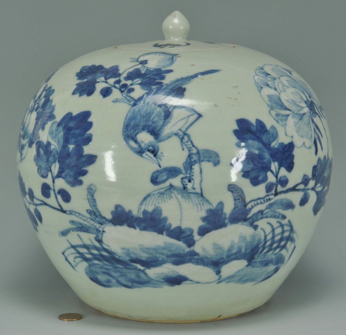 Chinese Blue And White Ginger Jar: Chinese blue and white covered ginger jar, round form decorated with bird, fruit and flowering branches. Lid decorated with three flying bats.9-1/2" H x 10" W. 20th century.