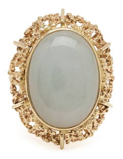18K Yellow Gold & White Jade Ring: Ladies'18K yellow gold ring featuring one (1) cabochon white jadeite jade. The ring is marked "18K" and XRF tests 18K gold. The ring is size 5 and has a gross weight of 12.94 grams.Additional