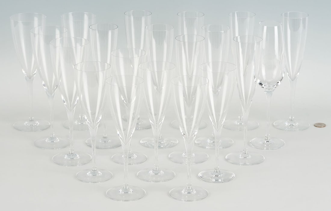 19 Baccarat Dom Perignon Crystal Glasses & 1 Tiffany Champagne Flute: Twenty (20) crystal champagne flutes including nine (9) Baccarat Dom Perignon flutes (9 1/4 in.), six (6) Baccarat Dom Perignon claret wine glasses (8 in.), four (4) Baccarat Dom Perignon water goblet