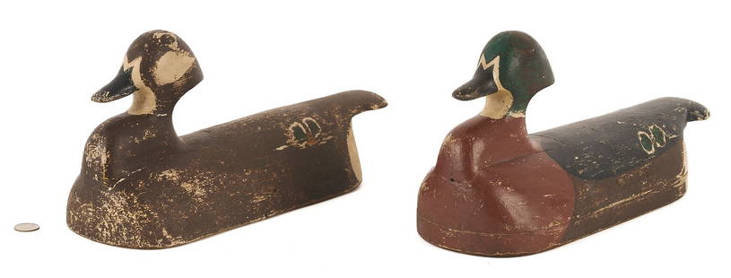 Pair of Maine Wood Duck Decoys: Pair of Maine wood duck decoys, drake and hen by an unknown maker, 3-piece construction with inletted heads. Both ducks retain their original paint. Hen: 7 1/2 in. H x 15 in. L. Drake: 8 in. H x 15 in