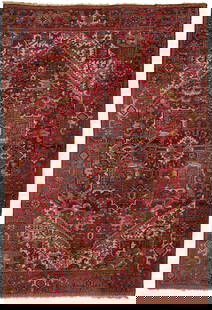 Persian Heriz Carpet, 11 ft. x 7 ft.: Large Persian Heriz rug or carpet, wool on cotton. Large central medallion having a red ground with various foliate and palmette designs flanked by ivory and red ground foliate spandrels, all within