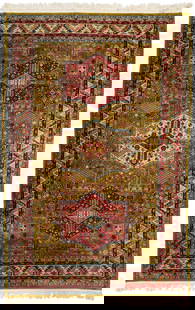 Caucasian Akstafa Style Pictorial Silk Carpet: Caucasian Akstafa style silk carpet with three central stylized medallions on a green field with birds and other geometric designs, within seven primary foliate and geometric borders. Woven in colors