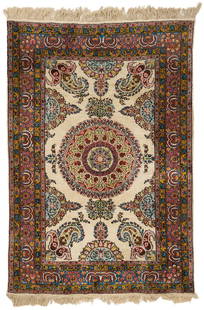 Persian Silk Qume Style Carpet: Persian silk Qume style carpet, silk on cotton, with central medallion and palmette decoration flanked by partial medallion and botah decoration, on a cream ground, within five primary foliate