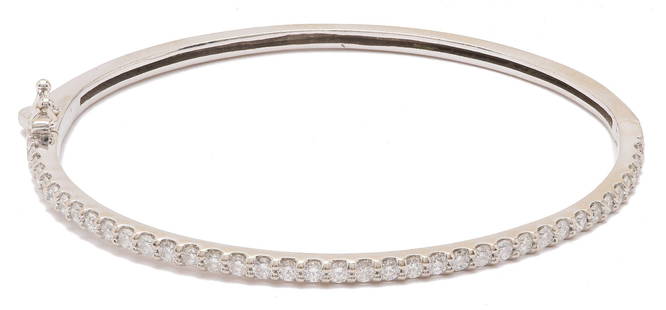 14K White Gold & Diamond Bangle Bracelet: Ladies 14K white gold bangle bracelet featuring thirty-seven (37) round brilliant cut diamonds approximately 1.52 carats together, Clarity-SI1, Color-G. The bracelet XRF tests 14K gold and is 7 in.. G