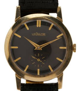 Vintage 14K Gold Le Coultre Wrist Watch: Vintage 14K yellow gold Swiss Le Coultre 480/CW caliber mechanical wristwatch, 17 jewels, manual wind, 33 mm. Black dial with seconds dial and gilt markers and hands. Serial # 05602. Fitted with a bla