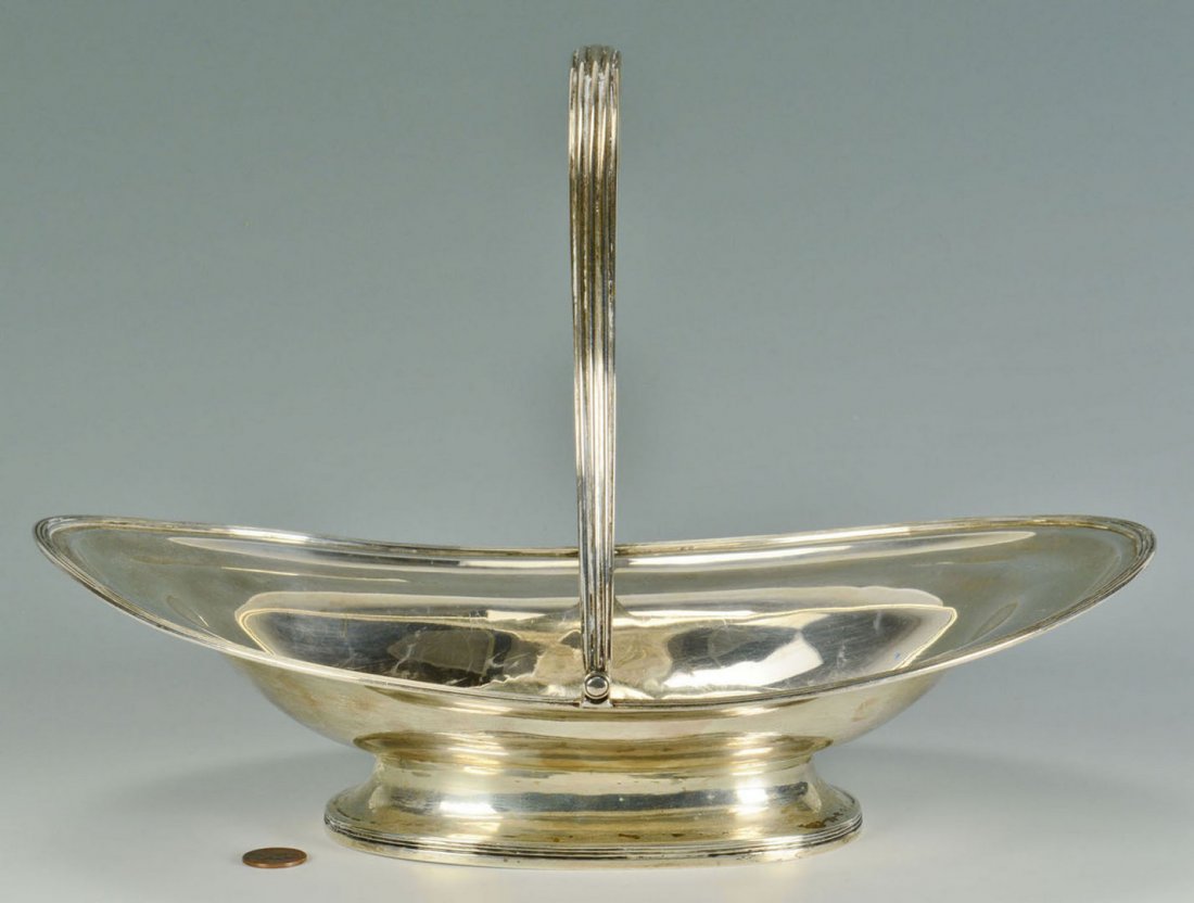 George III sterling silver cake basket: English George III sterling silver cake basket, oval form with reeded edges, handle and footring. Elaborate central monogram, WLW. Marks for London, 1804, maker's mark AK (likely Abstinado King). 4&qu