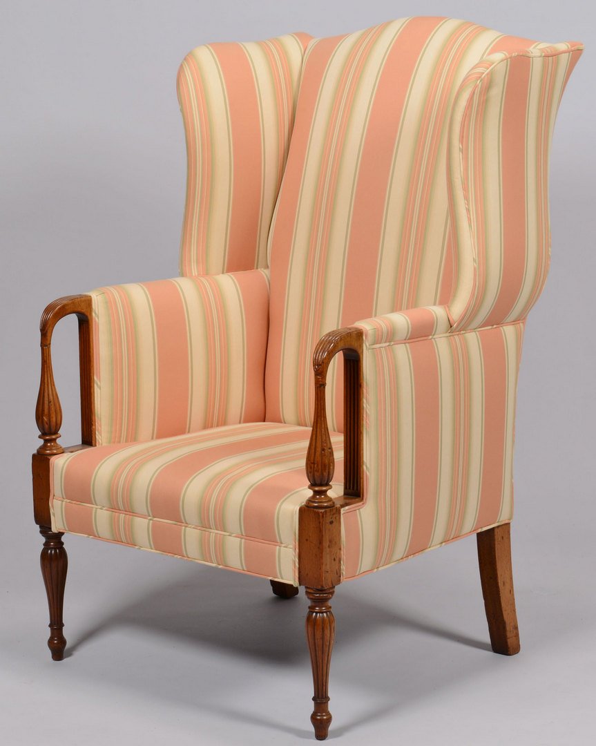 Sheraton Period Wing Chair w/striped upholstery: Sheraton period wing chair with later striped upholstery, carved reeded hand rests and turned feet. 47"H x 27"W x 24" D. Possibly Boston, circa 1810. Provenance: the estate of Margaret 