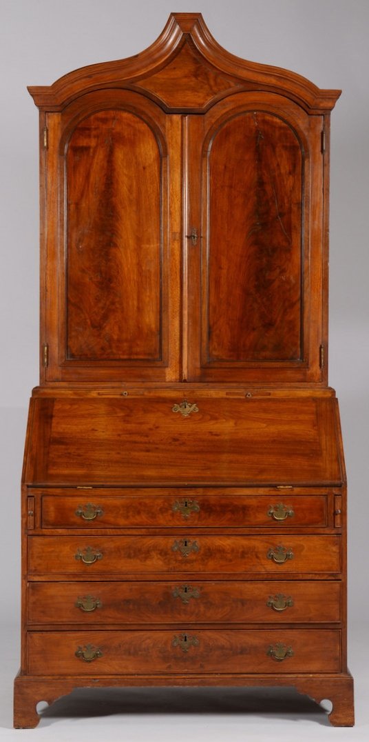 American Walnut Secretary Desk: American walnut secretary, comprised of two sections. Top section comprised of walnut with steeple cornice in the baroque taste, elaborate fitted block front interior. Base comprised of walnut primary