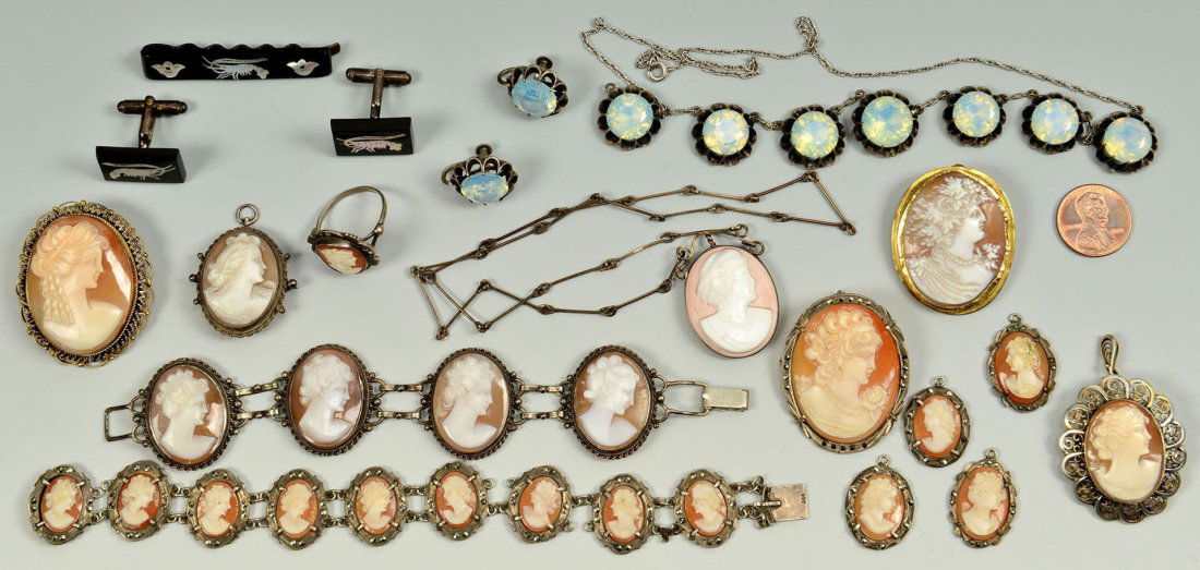 16 items cameo, moonstone, and mother of pearl jew: Includes a moonstone or cat's eye necklace on silver chain and a matching pair of screwback earrings; a black glass barette and matching pair of cufflinks, all with inlaid mother of pearl lobster desi