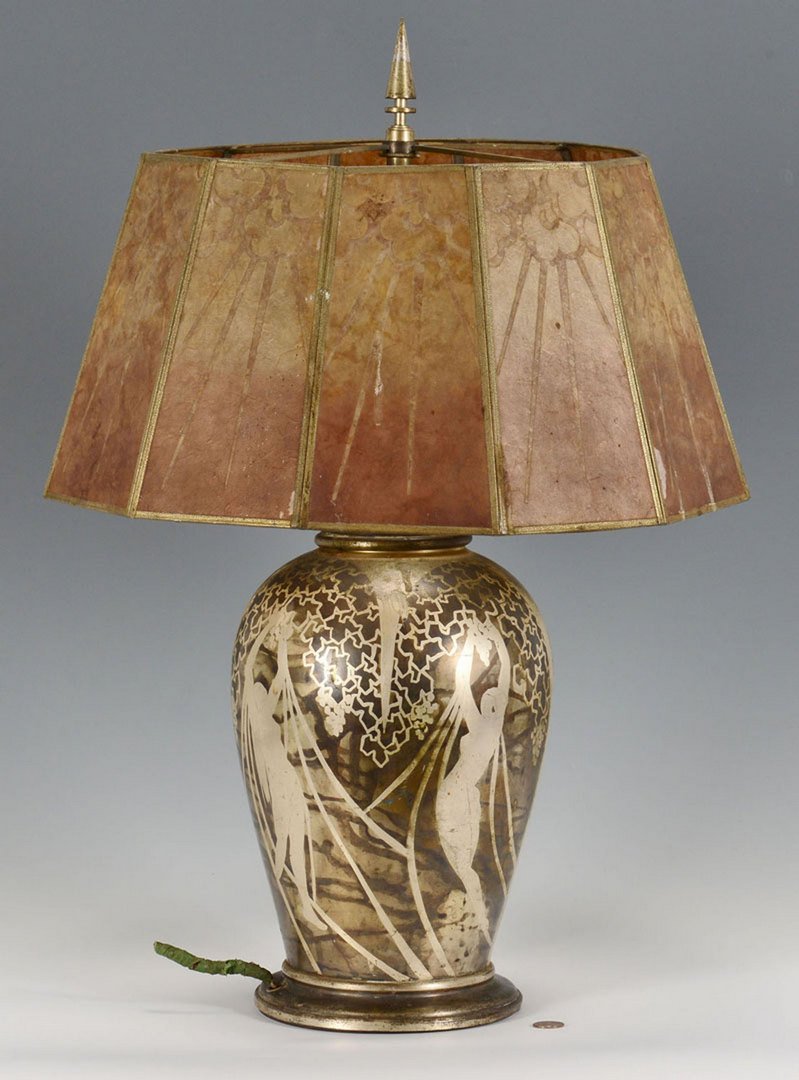 Art Deco Period Mica Lamp: Art Deco electric lamp with mica shade having a cloudburst design, silvered metal body etched with designs of nude women reaching towards wisteria. Signed Lautum or L'Autum. 24"H. Probably French