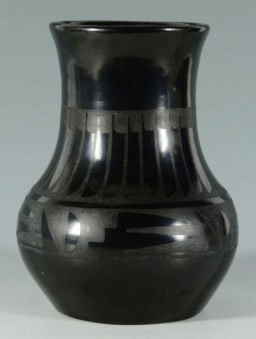 Maria & Santana San Ildefonso Black Ware Jar: A large San Ildefonso Maria & Santana Martinez black ware jar with feather and geometrical design to body. Incised signature on the base "Maria & Santana". 8 1/4" H. 1st half 20th centu