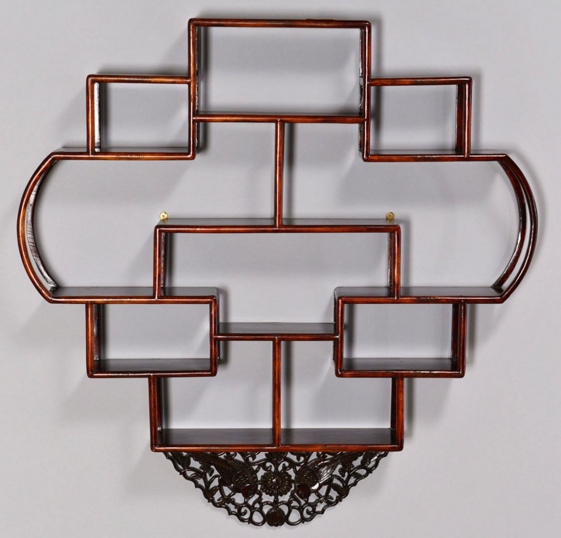 Chinese Hardwood Curio Display Shelf: Chinese hardwood curio display shelf, featuring a carved pierced crest which folds down to reduce height, over a rounded form with twelve shelves. 21-1/2" H (27" with crest extended) x 26&qu