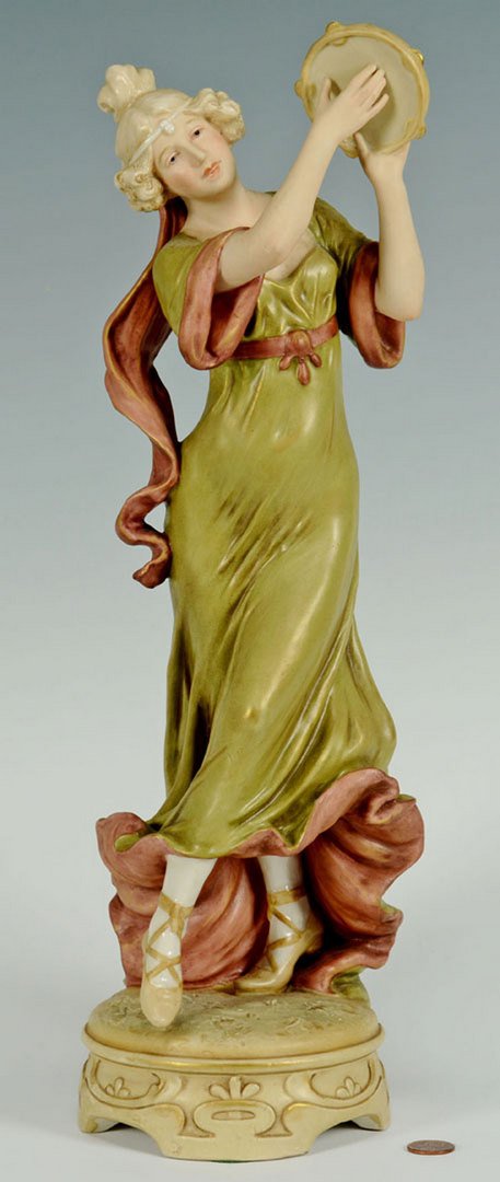 Royal Dux Porcelain Female Figure: Large Bohemia Royal Dux porcelain dancing female figure with tambourine. Base with triangular Royal Dux mark and impressed numbers of 1410. 17-1/2" H.