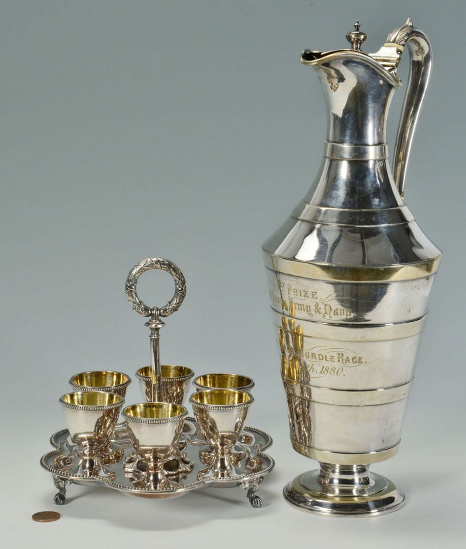 Victorian Trophy and Egg Server, 2 pcs: Two pieces Victorian silverplate. 1st item: Ewer with trophy presentation inscription: 1st Prize Officers Army & Navy, 120 Yards Hurdle Race, Portsmouth, 1880. Marked on bottom for C. Dimmer Plate, E 