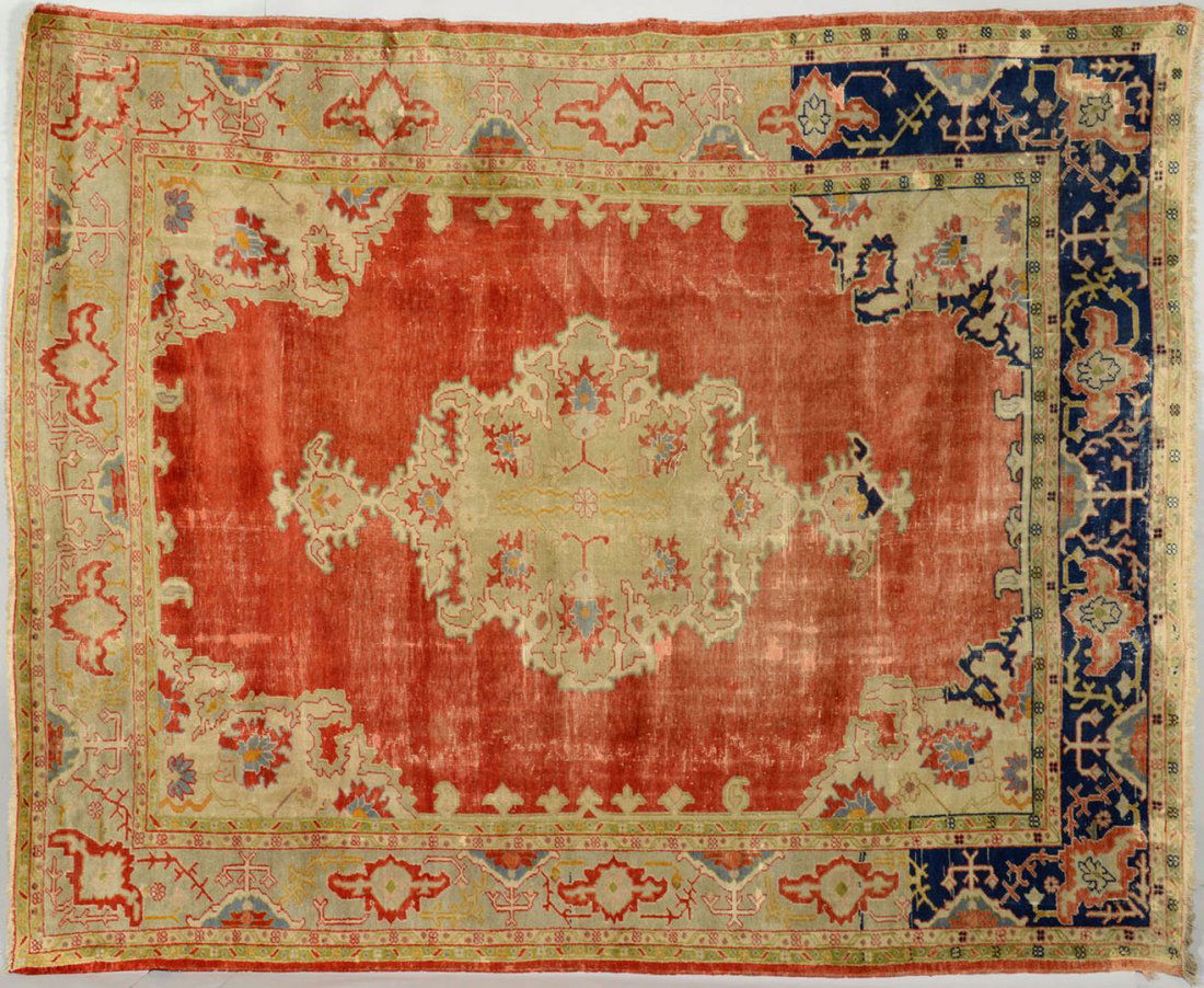 Semi-antique Turkish Ghiordes or Oushak Carpet: Semi-antique Turkish Ghiordes or Oushak carpet. Central medallion with geometric corner and border designs. Colors of salmon, blue, ivory, taupe/beige and sage green. 11 ft 9 in x 9 ft 7 in (141"