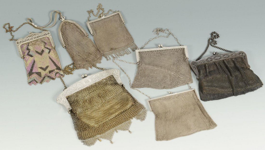 Group of 7 Ladies Mesh Bags, 3 Silver: Grouping of seven (7) ladies mesh bags including two marked "German Silver" and one marked "sterling", one colored Art Deco example, one dark grey example, and two silver metal exa