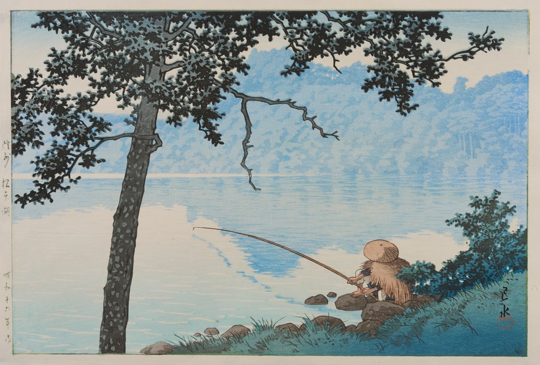 Hasui Japanese Woodblock Print, Lake Matsubara in Shinano Province: Kawase Hasui (Japan, 1883-1957) oban shin-hanga woodblock print, "Shinshu Matsubarako (Lake Matsubara in Shinano Province)," 1941. A fisherman holds a rod and sits beneath the branches