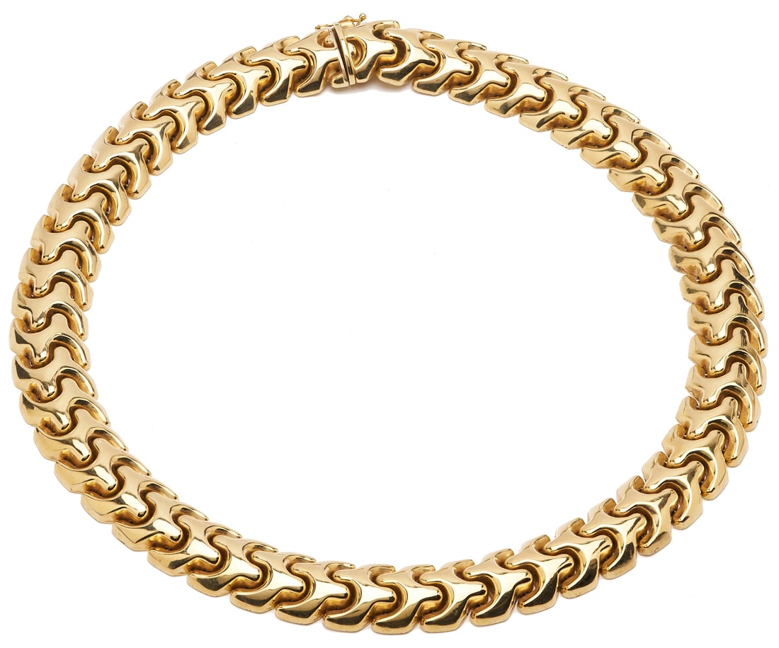 14K Gold Omega Link Necklace: Ladies' 14K yellow gold omega link necklace. The necklace is marked "14K Italy" and XRF tests 14K gold. The necklace is 19 in. L. and has a weight of 81.63 grams.Additional high-res