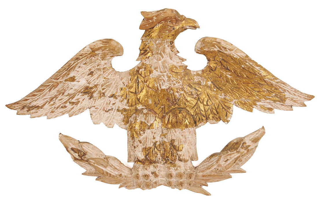 Carved Giltwood Eagle: Carved and gilt wood plaque depicting an American Federal Eagle with open wings, grasping a laurel sprig. With later gilding primarily extant on right wing, body, and head. 14 in.