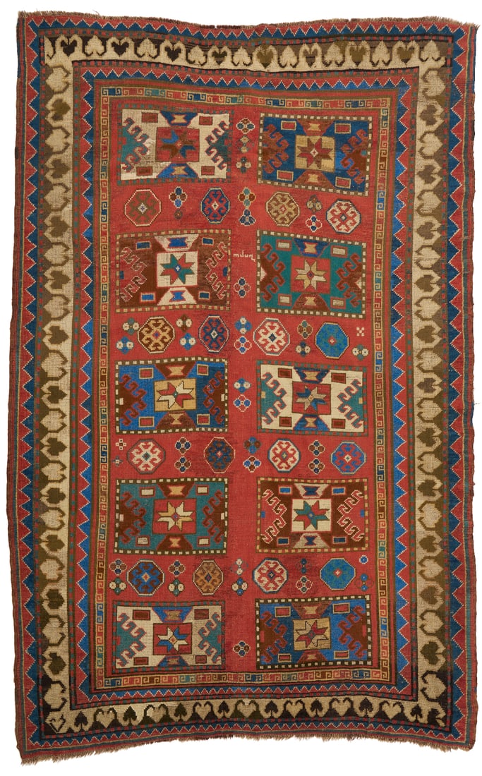 Antique Caucasian Kazak Area Rug, 5 x 7: Antique Caucasian Kazak area rug, wool on wool. The center with alternating geometric medallions on a brick red ground and signed on one end, within three primary borders. Woven in red, blue, ivo