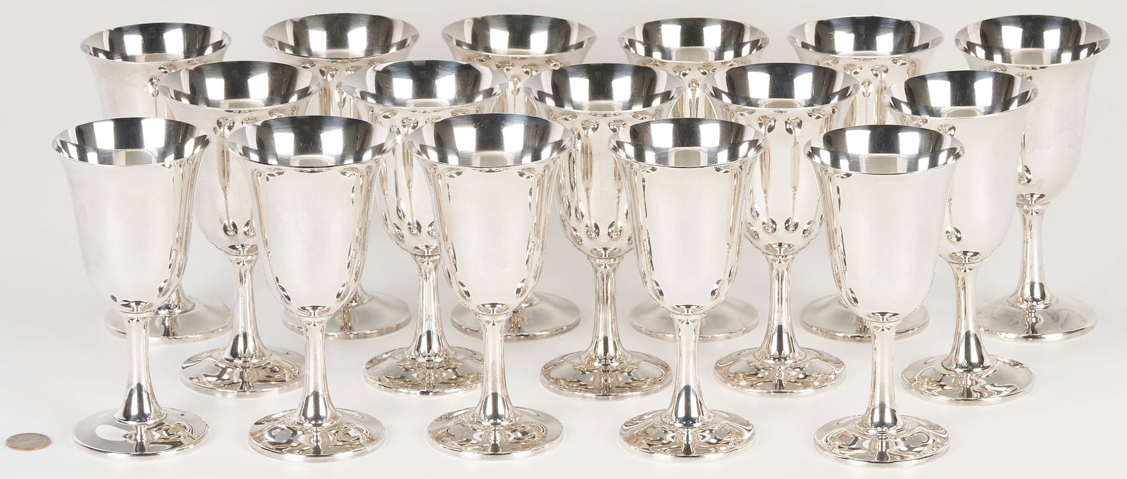 Set of 16 Wallace Sterling Silver Goblets: Set of sixteen (16) Wallace sterling silver water goblets. All with maker's mark to the base and stamped "14." Height - 6 5/8 in. Weight: 92.775 total troy ounces. American, mid 20t