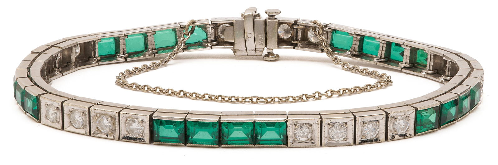 14K Gold, Diamond, & Glass Bracelet: Ladies' 14K white gold line bracelet featuring twenty (20) round brilliant cut diamonds approximately 1.40 carats together, Clarity-VS1, Color-H and twenty (20) emerald cut green glass doublets. The