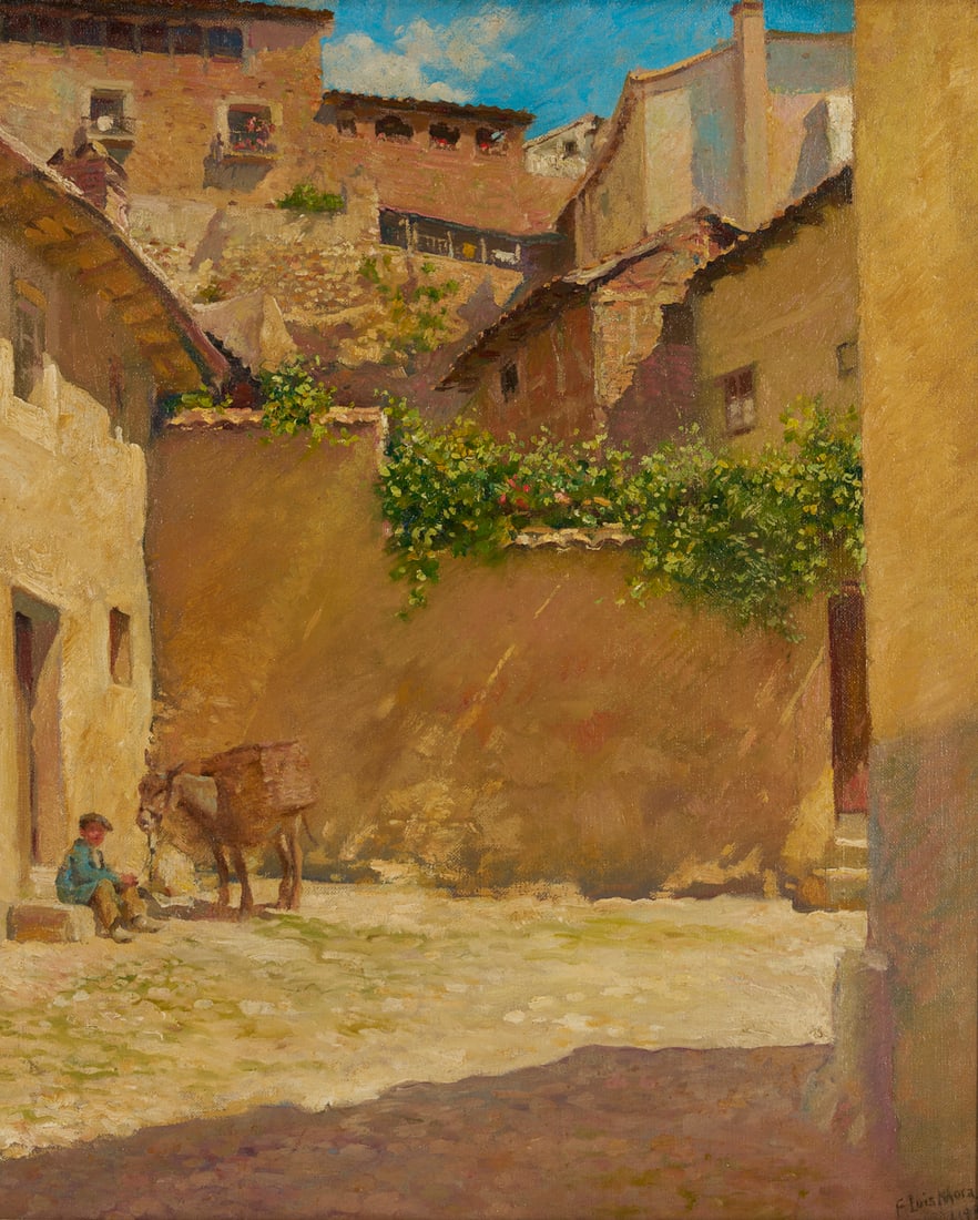 F. Luis Mora O/C Spanish Village Street Scene Painting: Francis Luis Mora (American/Uruguay, 1874-1940) oil on canvas village street scene, likely Spain, with a boy seated beside a donkey, 1909. Behind the boy buildings rise above a wall covered with flowe