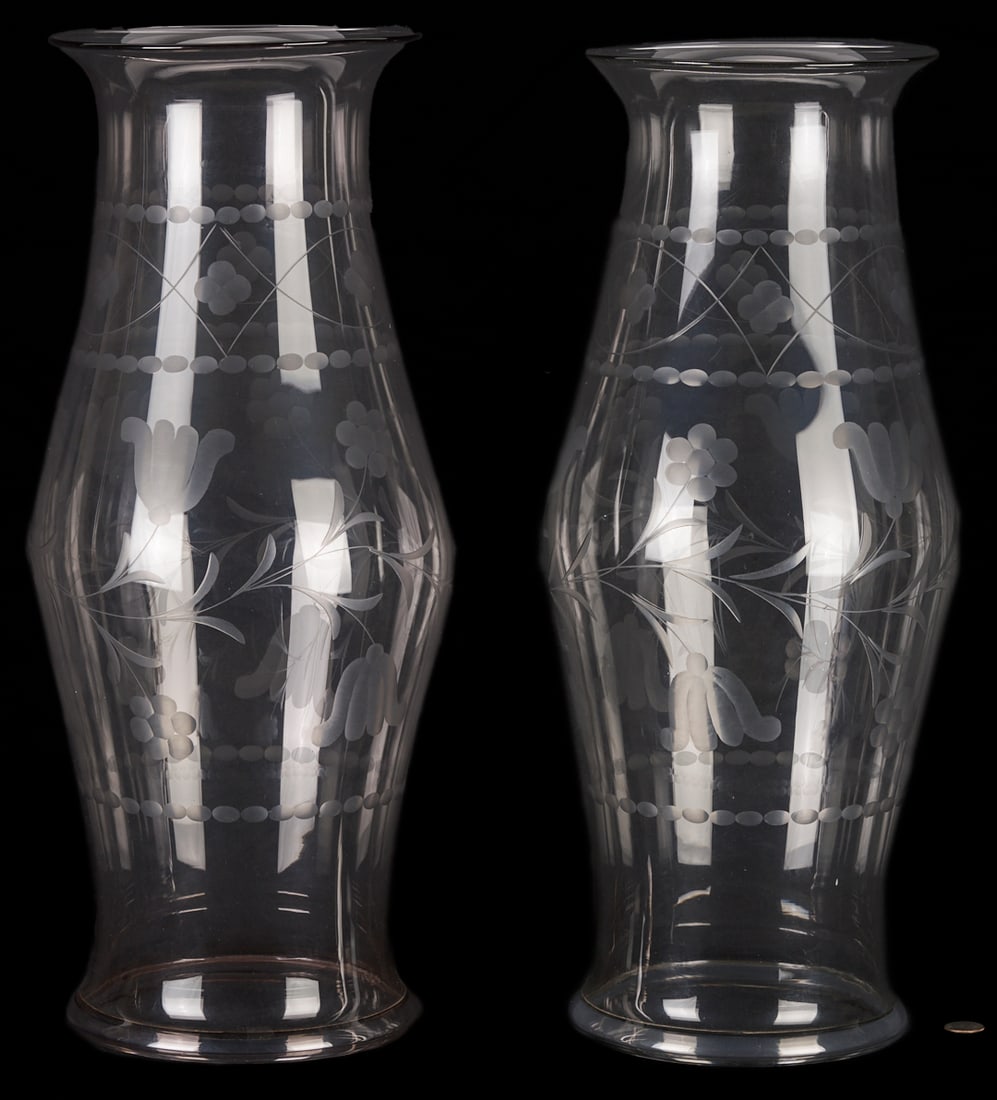 Pair Glass Hurricane Shades: A Pair of tall blown and etched glass hurricane shades with floral and bead course decoration, flared rims and bulbous mid sections. 23 in. H. 19th century. Additional high-resolution photos and a