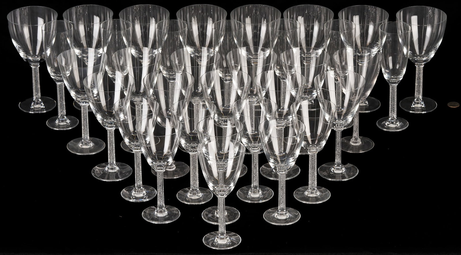 34 pcs Lalique Phalsbourg Crystal Stemware: 34 Lalique goblets and glasses in the Phalsbourg pattern, with squared, frosted stems molded with grapes and vines. Included are Eight (8) Tall Water goblets, 7 5/8 in. H; Eleven