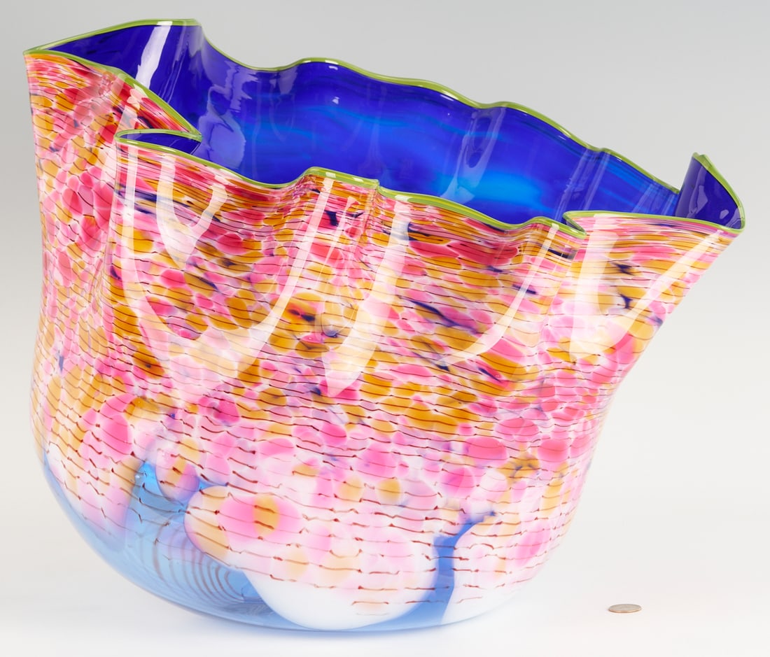 Dale Chihuly Art Glass Sculpture in Orange, Pink, and Blue w/ Green Lip: Dale Chihuly (Tacoma, WA, b.1941) Macchia art glass sculpture, the exterior in orange and pink and interior in blue and clear, with lime green lip. Signed and dated 1985 on the base. 16 in. H x 20