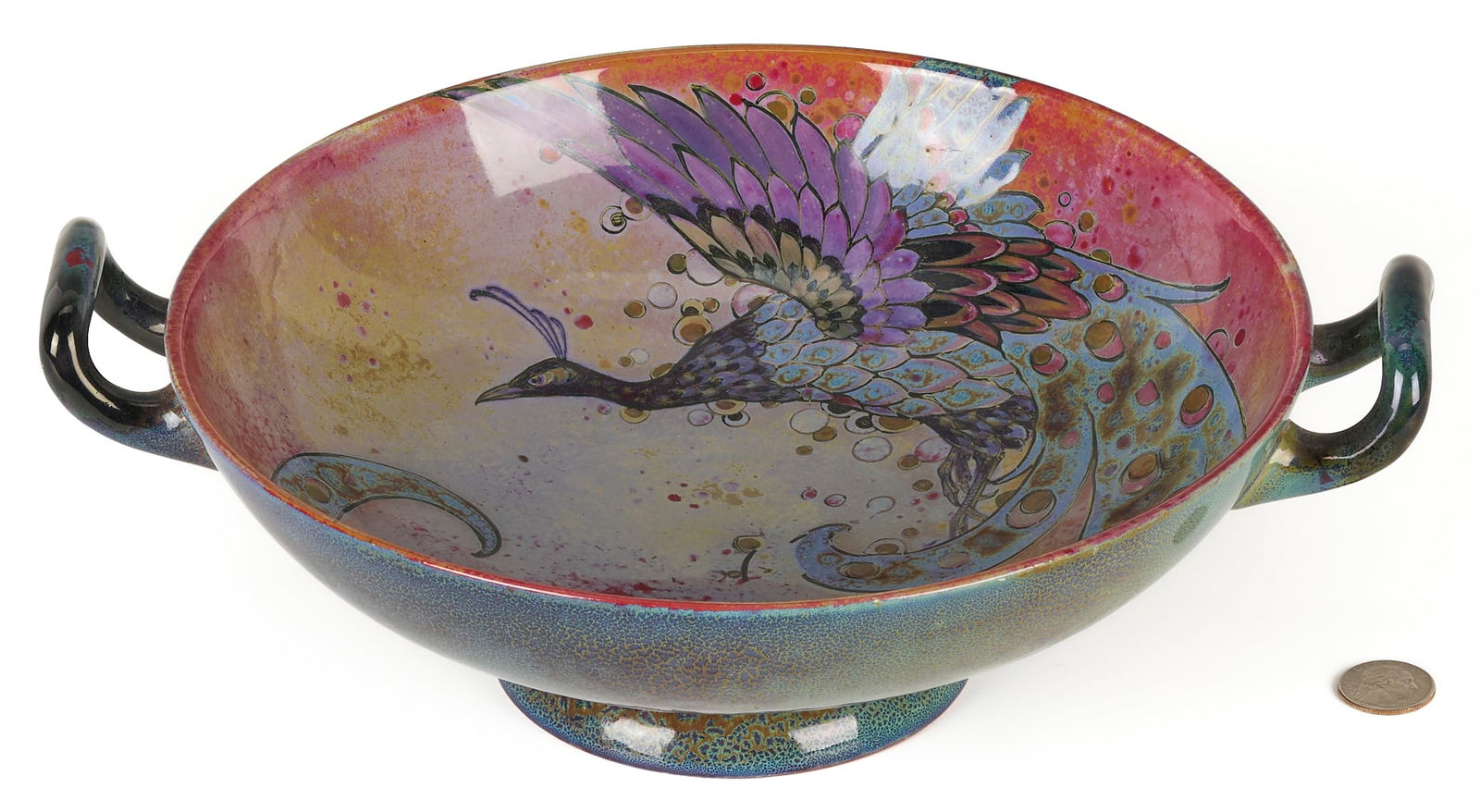 Royal Doulton "Sung" Flambe Glaze Bowl: Rare Charles Noke Royal Doulton Sung Ware double-handled footed bowl with flambe glaze and peacock decoration to center. Signed by Noke and numbered 226, impressed 7619 A with Royal Doulton