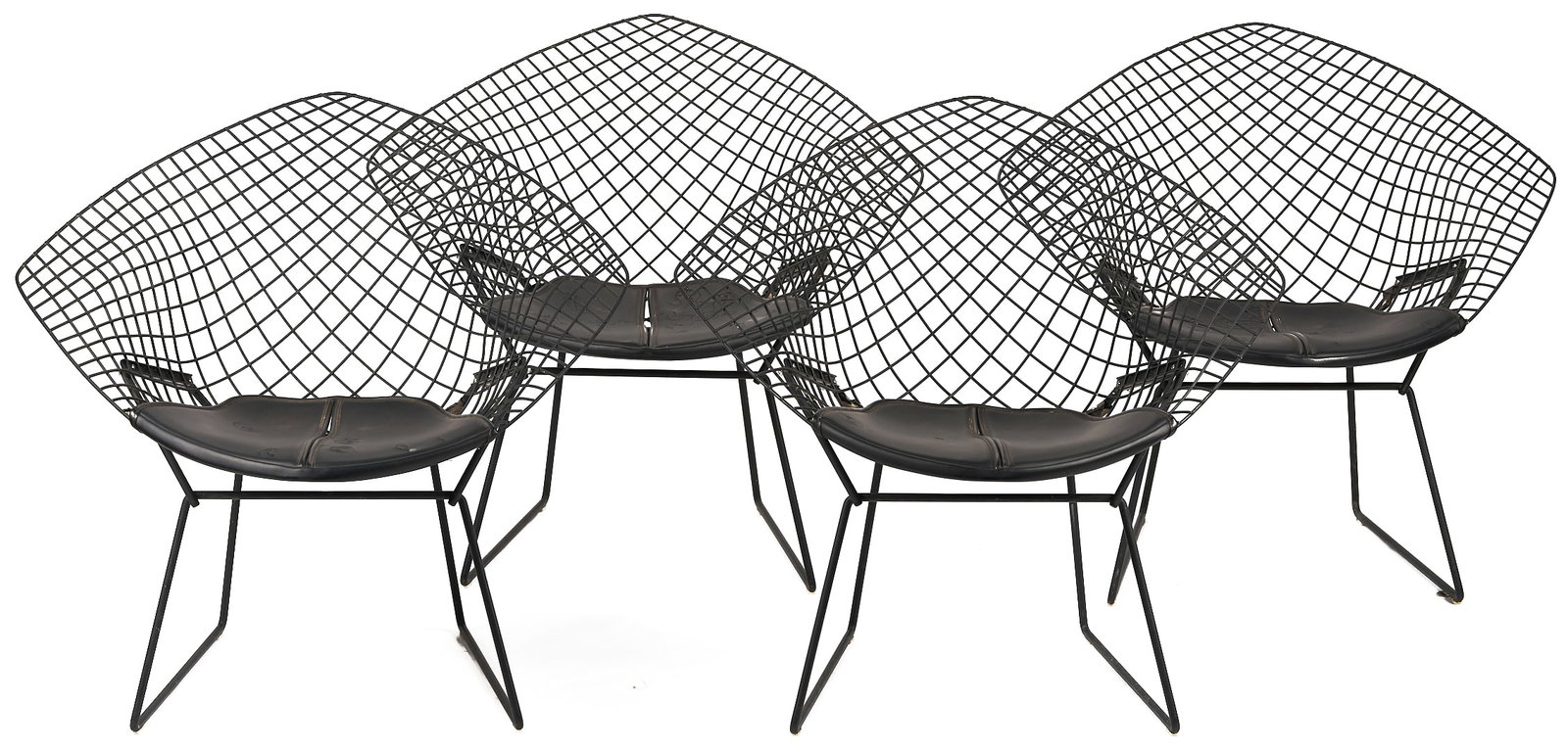 Four Knoll Mid Century Bertoia Diamond Chairs: Set of four (4) Harry Bertoia (Italian, 1915-1978) diamond chairs, designed for and made by Knoll, with black resin finish and black leather seats. The leather seats with "Knoll International, Inc. 65