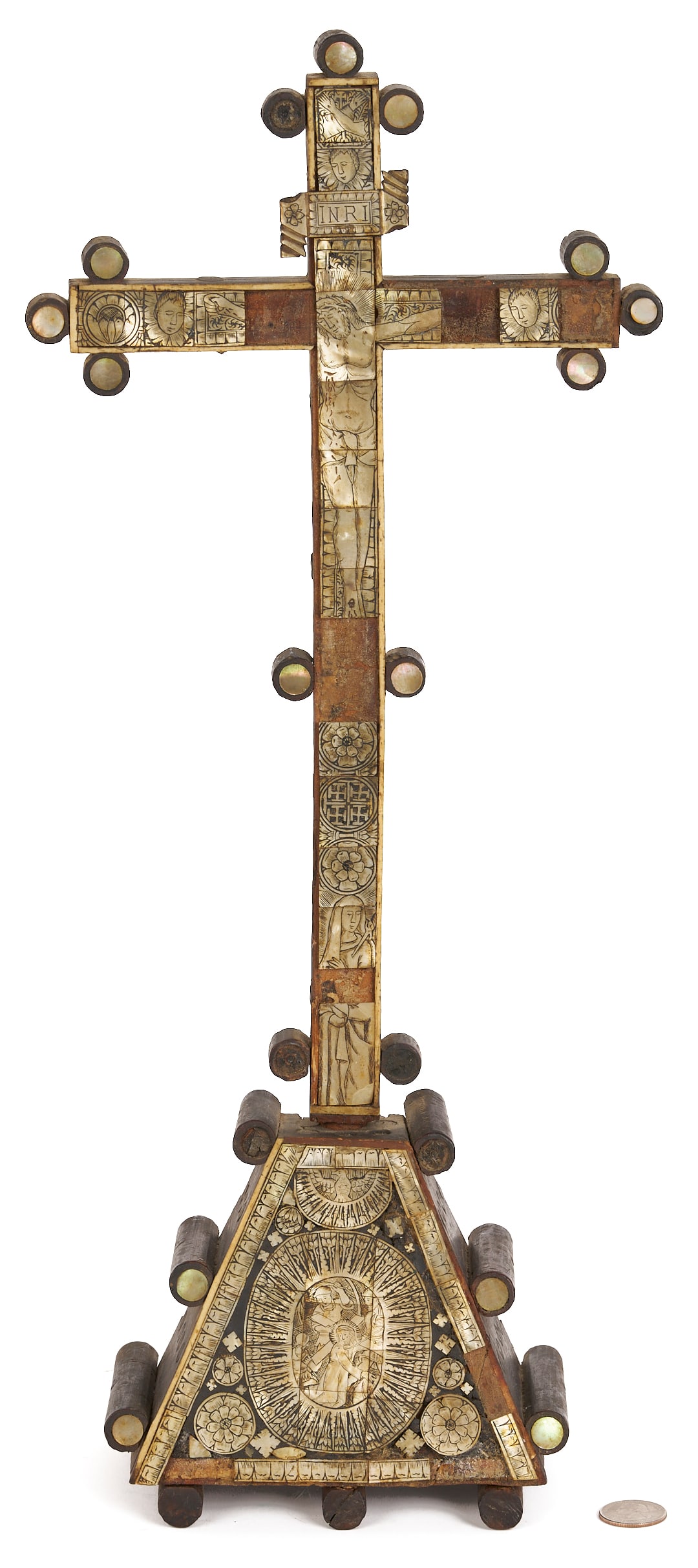 Mother of Pearl Inlaid Reliquary Crucifix: An Indo-Portuguese or Jerusalem mother-of-pearl inlaid wooden Reliquary Crucifix with inlaid decoration depicting Christ on the cross, geometric and foliate designs, with other Franciscan symbols
