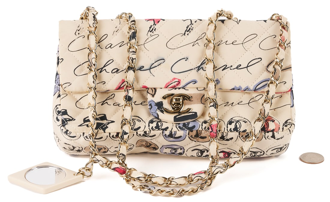 Chanel Nylon Quilted Rue Cambon Camellia Bag: Chanel nylon quilted Rue Cambon Camellia printed mini flap bag, cream ground with multicolor print. fabric, threaded gold chainlink strap, a gold CC turn lock on the front, and a matching printed