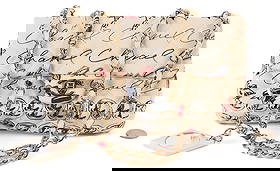 Chanel Nylon Quilted Rue Cambon Camellia Bag: Chanel nylon quilted Rue Cambon Camellia printed mini flap bag, cream ground with multicolor print. fabric, threaded gold chainlink strap, a gold CC turn lock on the front, and a matching printed