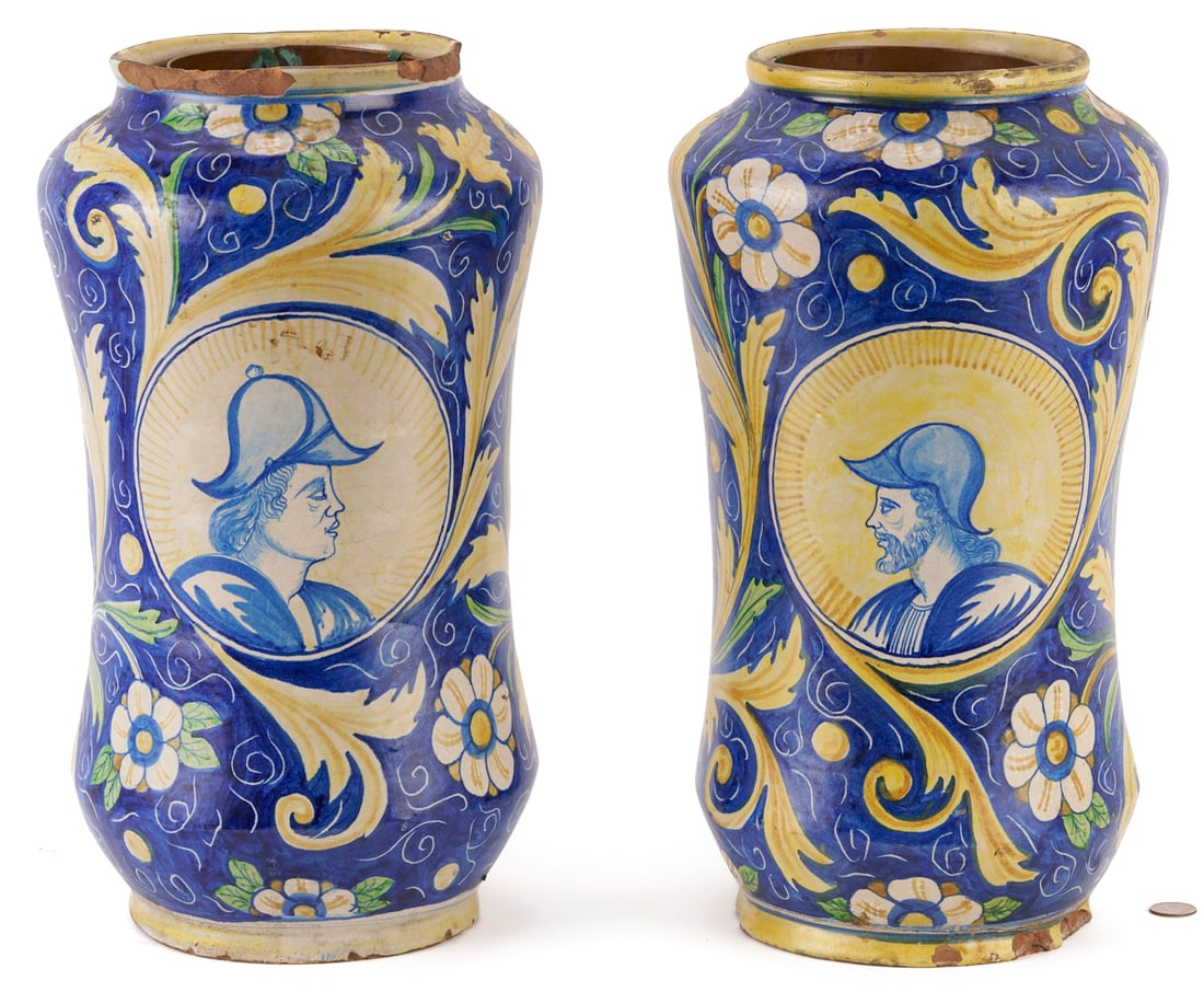 Pair Italian Faience Maiolica Albarello Portrait Jars: A pair of 18th Century Italian faience or majolica Albarello or Apothecary jars of narrow waisted form, with opposing central portrait vignettes, surrounded by colorful flowers and leafy scrolls