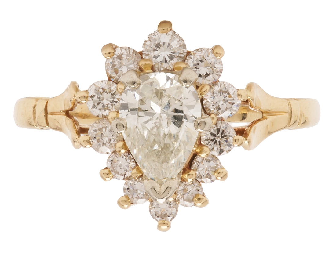14K Gold & Diamond Cocktail Ring: Ladies' 14K yellow gold cocktail ring featuring one (1) pear shaped diamond approximately 0.88 carats, Clarity-I1, Color-I, accented by twelve (12) round brilliant cut diamonds approximately 0.82