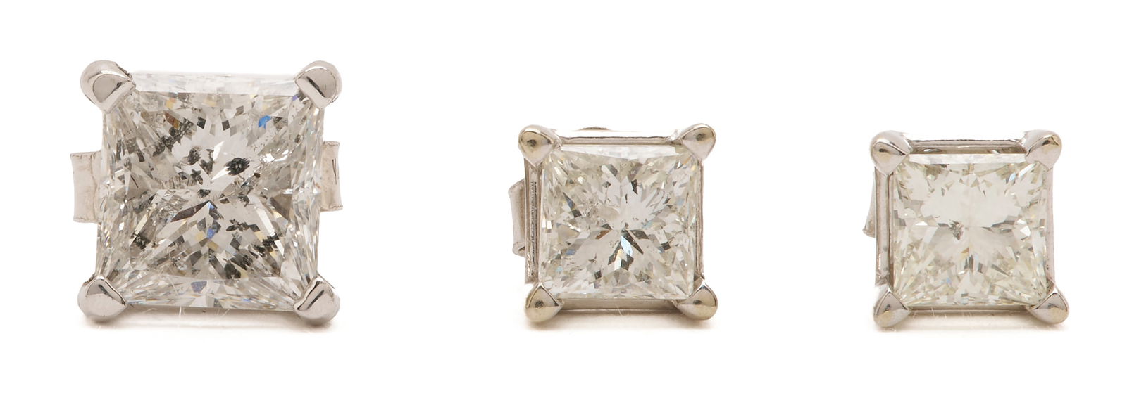 Three 14K Gold & Diamond Stud Earrings: 1st item: 14K white gold single stud earring featuring one (1) princess cut diamond approximately 1.01 carats, Clarity-I1, Color-H. The earring is marked "14K" and XRF tests 14K gold. T
