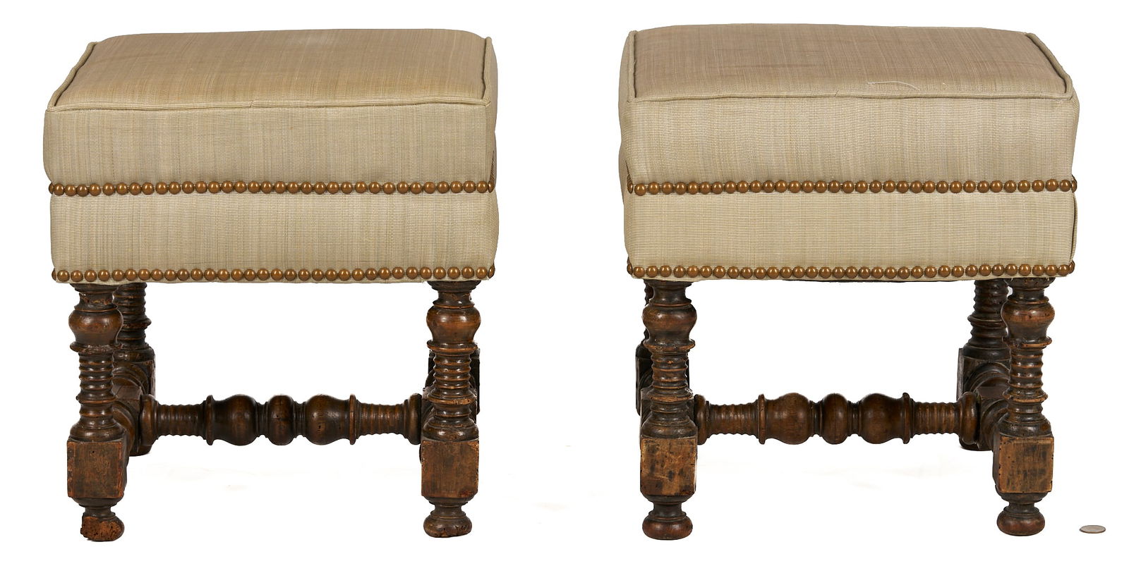 Pair Jacobean Upholstered Stools: Pair of stools featuring modern taupe designer upholstery with brass nail head trim on Jacobean late 17th century ring, ball and block turned legs and stretchers, likely salvaged from